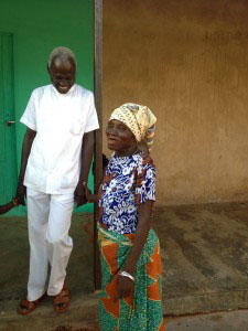 Dr. Abdulai laughs with a patient at his clinic