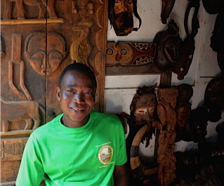 Mohammad Sanio is a craftsman at the market who is skilled at ebony carving-- and world geography.