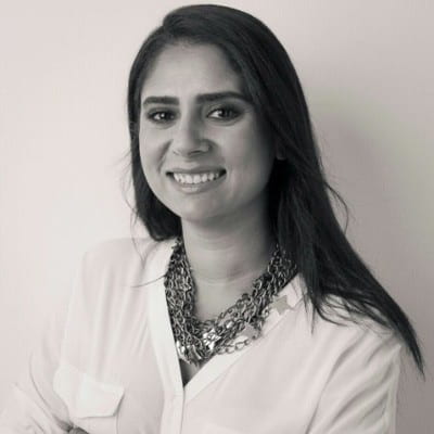 Smiling dark-haired woman in black and white