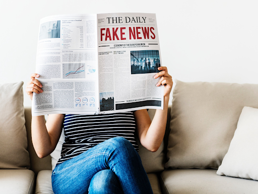 A woman reading a newsppaer