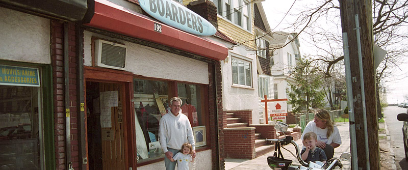 Boarders surf shop owner Steve Stathis, his daughter-in-law Jeanine, and his grandchildren Paige and Damien enjoy the spring sun on Beach 92nd street in Rockaway, Queens. PHOTO: Carl Critz.